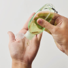 Additional Thumbnail Image 1 - a person pouring liquid into a bottle