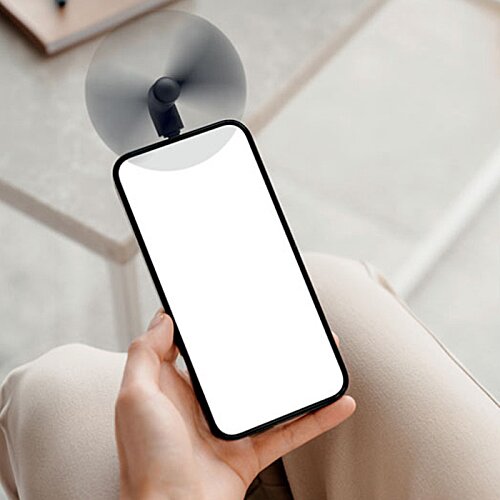 Additional Image 2 - a person holding a phone with a fan