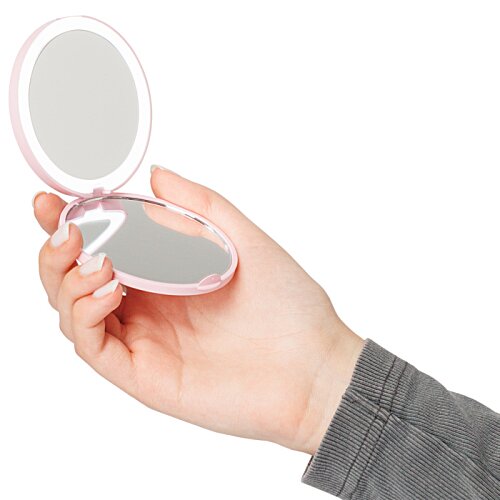 Additional Image 2 - a hand holding a small mirror