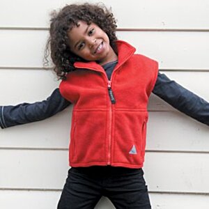 Additional Image 2 - a girl with arms out in front of a white wall