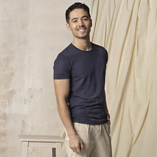 Additional Image 2 - a man standing against a wall