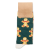 a green and yellow sock with a gingerbread man pattern