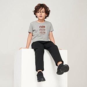 Additional Image 2 - a boy sitting on a white cube
