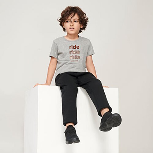 Additional Image 2 - a boy sitting on a white cube