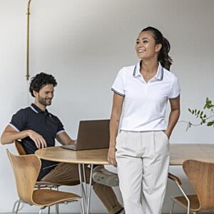 Additional Image 5 - a woman standing in front of a table