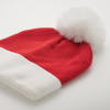 a red and white hat with a white pom