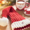 a red and white hat and a mug of coffee