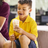 a boy eating ice cream