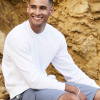 a man sitting on a rock