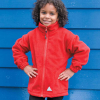 a young girl in a red jacket