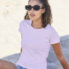 a woman wearing sunglasses and a pink shirt