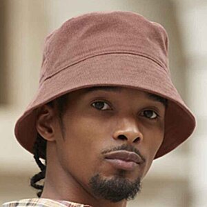 Additional Image 1 - a man wearing a hat
