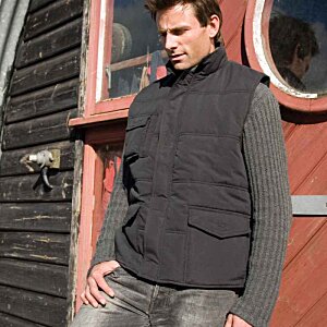 Additional Image 1 - a man standing in front of a red door