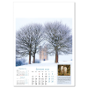 a calendar with trees in the snow