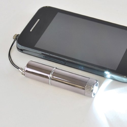 Additional Image 3 - a cell phone charging on a white surface