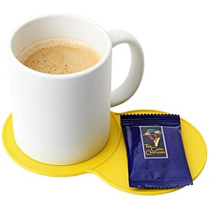 Additional Image 3 - a white mug with a liquid in it next to a small packet