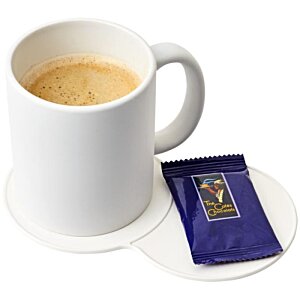 Additional Image 4 - a white mug with a brown liquid and a blue packet