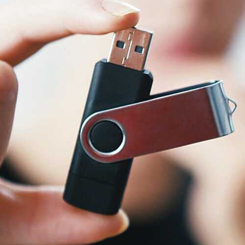 Additional Image 1 - a hand holding a usb drive