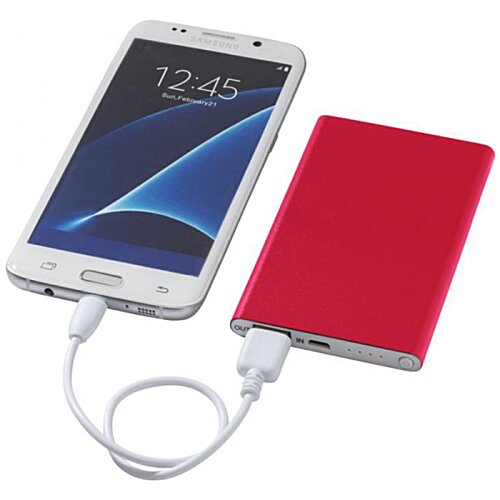 Additional Image 6 - a cell phone charging with a red case