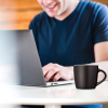 Additional Thumbnail Image 4 - a man sitting at a table with a laptop