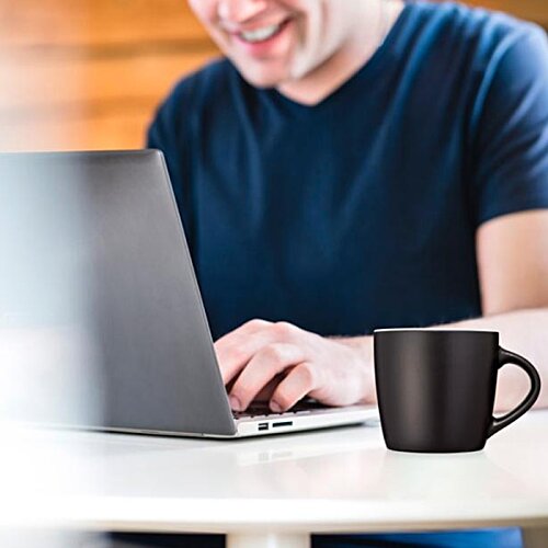 Additional Image 4 - a man sitting at a table with a laptop