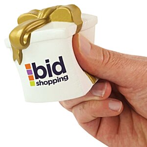 Additional Image 1 - a hand holding a small white object with a gold ribbon