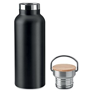Additional Image 2 - a black bottle next to a small metal bucket