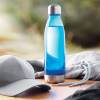 a blue bottle on a table