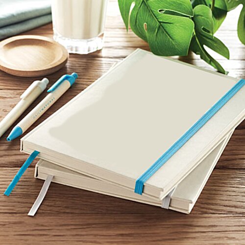 Additional Image 8 - a stack of notebooks and pens on a table