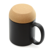 a black and tan mug with a handle