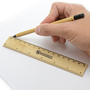 Additional Image 3 - a hand holding a pencil and ruler