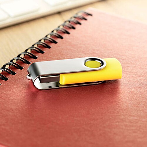 Additional Image 6 - a yellow and silver usb flash drive on a red notebook