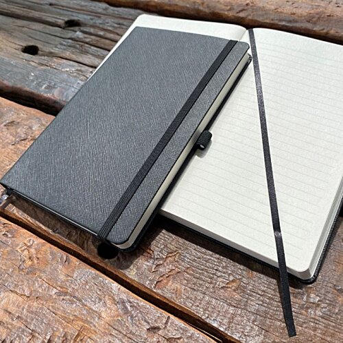 Additional Image 3 - a black notebook and a stick on a wooden surface