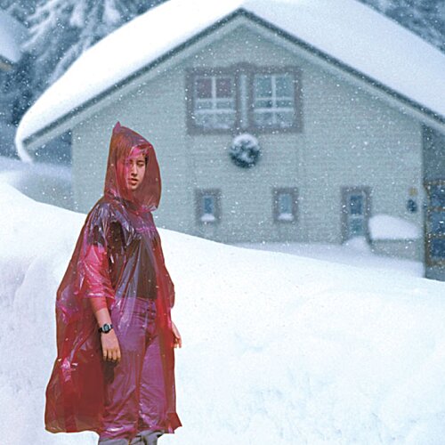 Additional Image 1 - a person in a red coat in front of a house