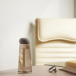 Additional Image 1 - a glass bottle on a table