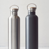 a close-up of two metal bottles