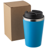 a blue coffee cup next to a box