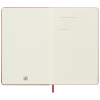 a white notebook with a red bookmark