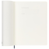 a white book with a blue pen