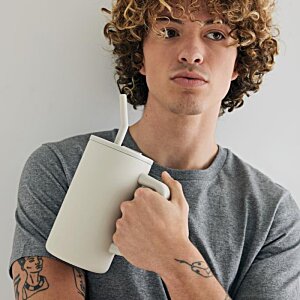 Additional Image 3 - a man holding a white cup