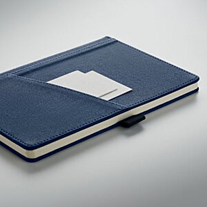 Additional Image 5 - a blue notebook with a white label