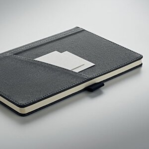 Additional Image 6 - a black leather notebook with a white label