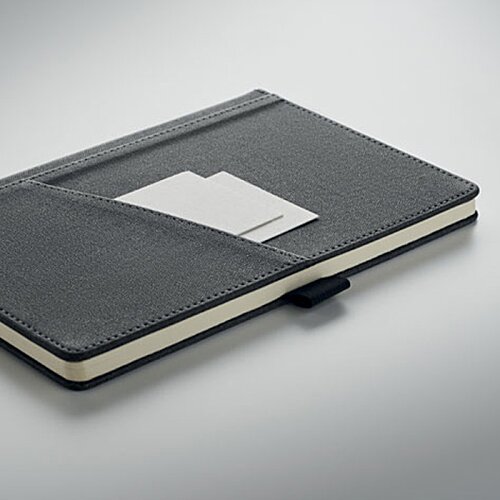 Additional Image 6 - a black leather notebook with a white label