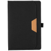 a black leather notebook with a brown pocket