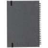 a grey notebook with black edges