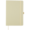 a white notebook with a gold band