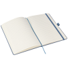 a white notebook with blue band