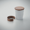 a white cup with a brown lid