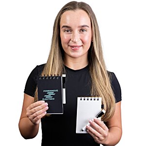 Additional Image 2 - a woman holding a book and a pen