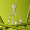 a wooden object with wires and a green background